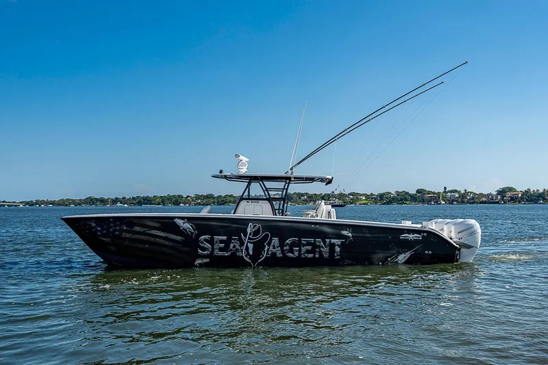 The Image of 2018 Invincible 40 Catamaran on water, clear sky, side view. - 0