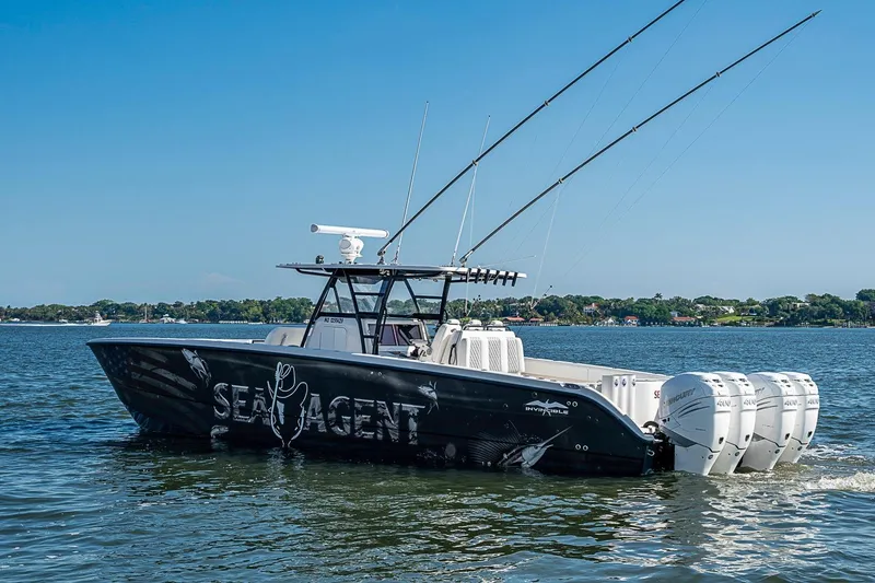 Slide: The Image of 2018 Invincible 40 Catamaran on water, featuring four powerful engines. - 1