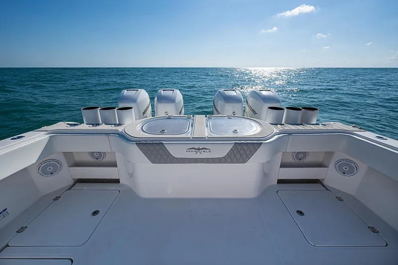 Slide: The Image of Invincible 40 Catamaran 2018 on open sea, showcasing powerful engines and sleek design. - 14