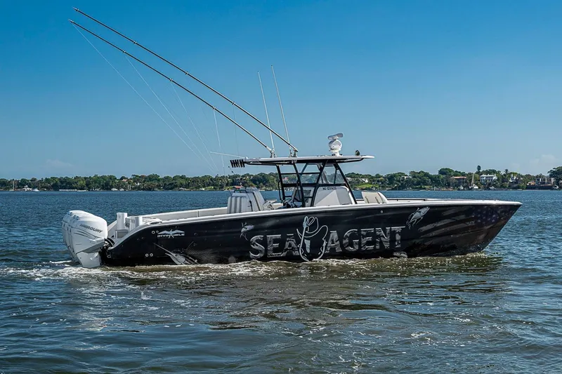 Slide: The Image of 2018 Invincible 40 Catamaran "Sea Agent" cruising on a sunny day. - 2