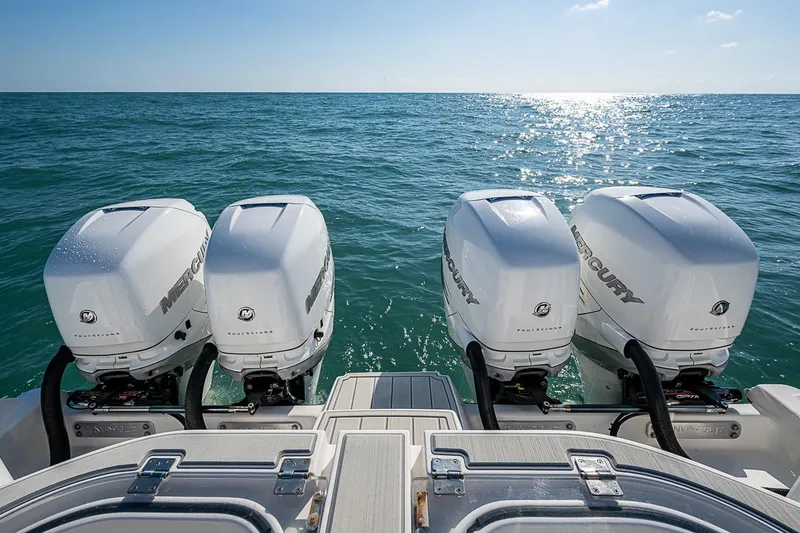 Slide: The Image of Four Mercury outboard engines on a 2018 Invincible 40 Catamaran, ocean view. - 21