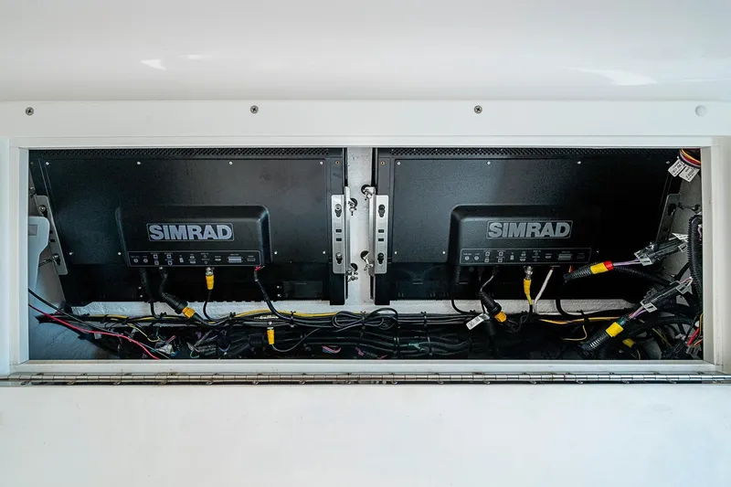 Slide: The Image of Simrad electronics setup on 2018 Invincible 40 Catamaran, showcasing wiring and installation. - 24