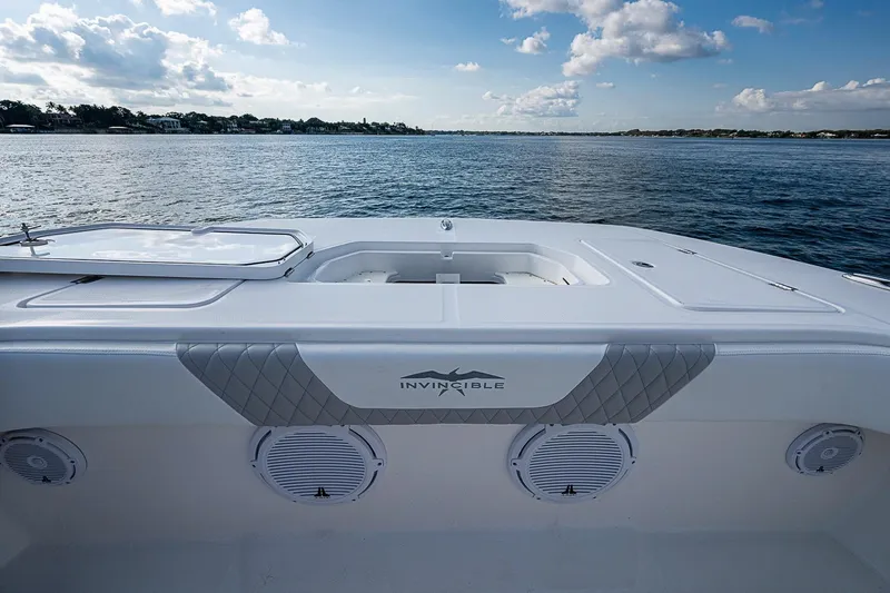 Slide: The Image of 2018 Invincible 40 Catamaran deck overlooking calm waters and blue sky. - 5