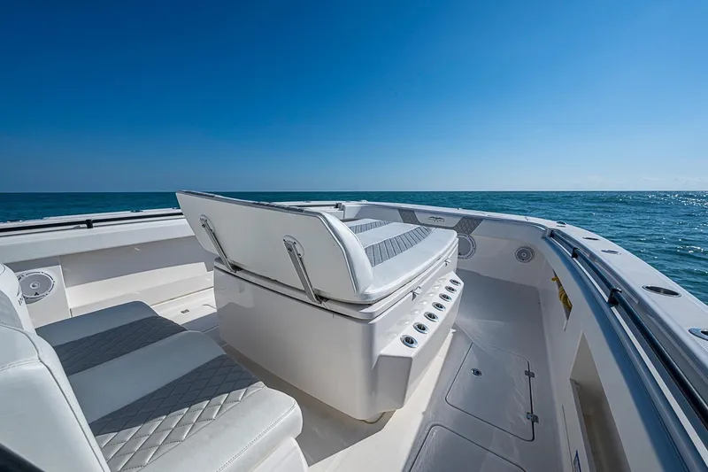 Slide: The Image of Invincible 40 Catamaran 2018 on open sea, showcasing sleek seating and spacious deck. - 9