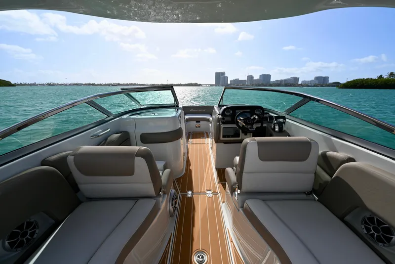 Slide: The Image of 2020 Crownline Eclipse E305 XS boat interior with scenic ocean view. - 11