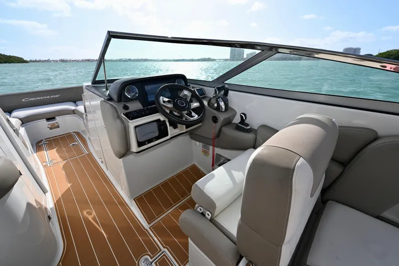 Slide: The Image of 2020 Crownline Eclipse E305 XS boat interior with steering wheel and seating. - 12