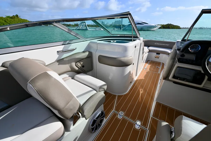 Slide: The Image of 2020 Crownline Eclipse E305 XS boat interior with luxurious seating and sleek design. - 15