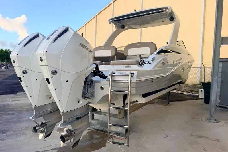Slide: The Image of 2020 Crownline Eclipse E305 XS boat with dual Mercury outboard engines. - 24