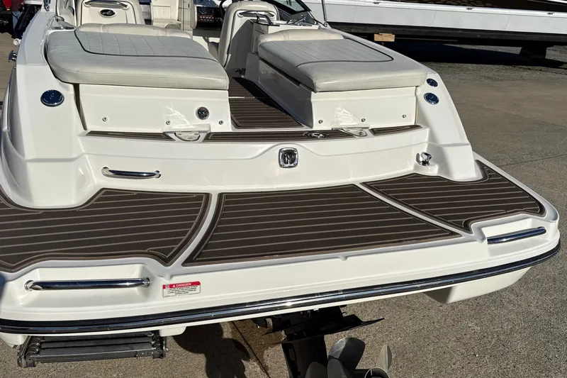 Slide: The Image of 2007 Sea Ray 250 Select EX boat with cushioned seating and sleek deck design. - 10