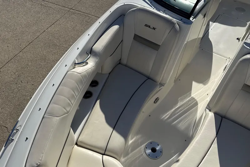 Slide: The Image of 2007 Sea Ray 250 Select EX boat interior with white leather seating. - 18