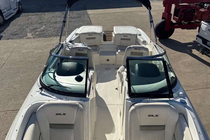 Slide: The Image of 2007 Sea Ray 250 Select EX boat with white interior and SLX branding. - 20