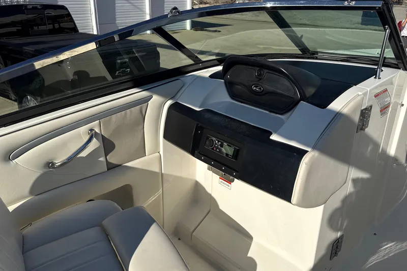 Slide: The Image of Interior view of 2007 Sea Ray 250 Select EX boat cockpit with seating and dashboard. - 21