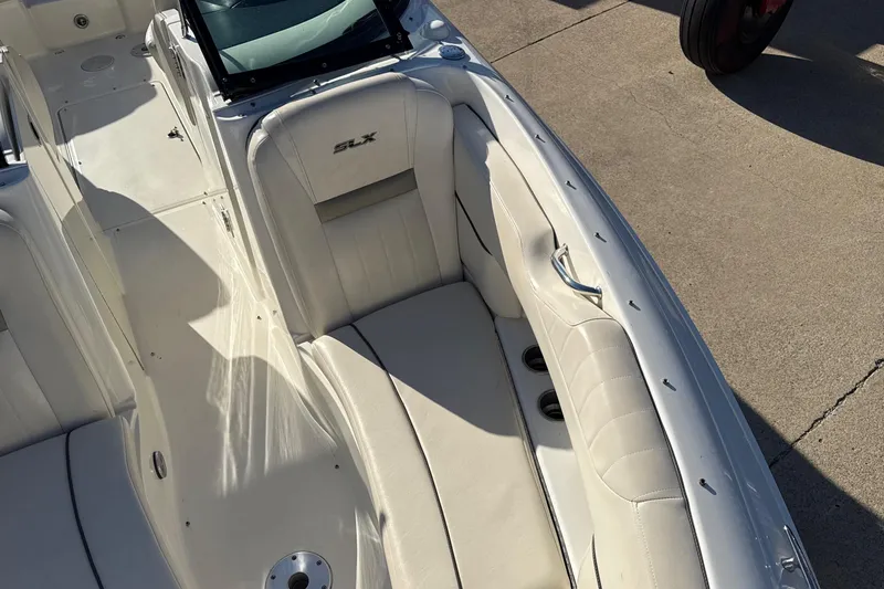 Slide: The Image of Interior of 2007 Sea Ray 250 Select EX boat with white seating and cup holders. - 22