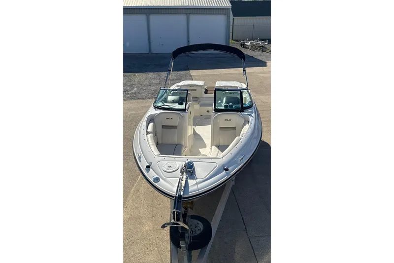Slide: The Image of 2007 Sea Ray 250 Select EX boat on trailer, featuring sleek design and spacious seating. - 8