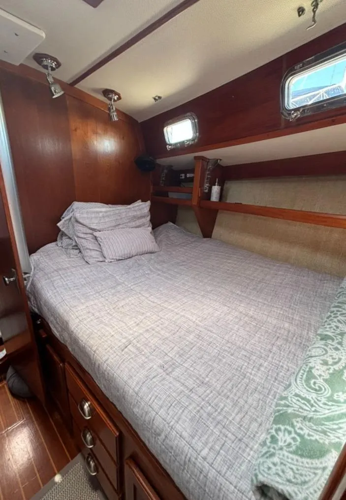 Slide: The Image of Interior of 1989 Caliber 38 sailboat with wood finish. - 11