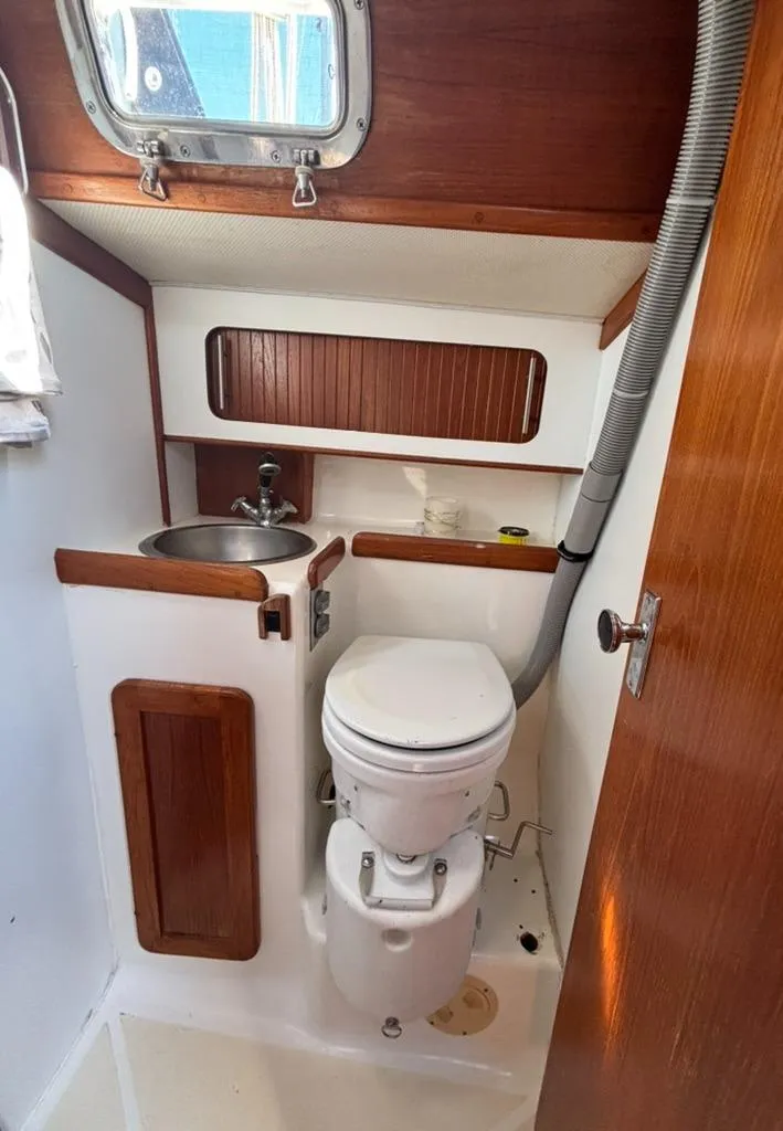 Slide: The Image of Interior of a 1989 Caliber 38 yacht with sink and storage. - 14