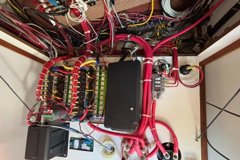 Slide: The Image of Electrical system of a 1989 Caliber 38 with wires and circuit boxes. - 19