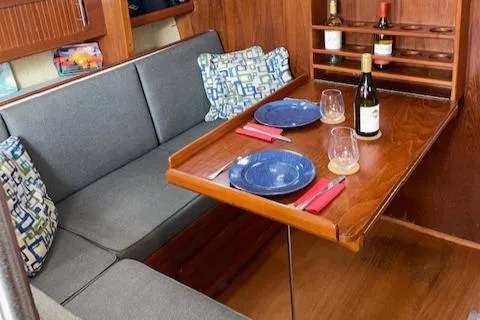 Slide: The Image of Interior of a 1989 Caliber 38 yacht with dining table. - 4