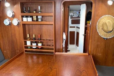 Slide: The Image of Interior of 1989 Caliber 38 sailboat with cozy seating and nautical decor. - 5