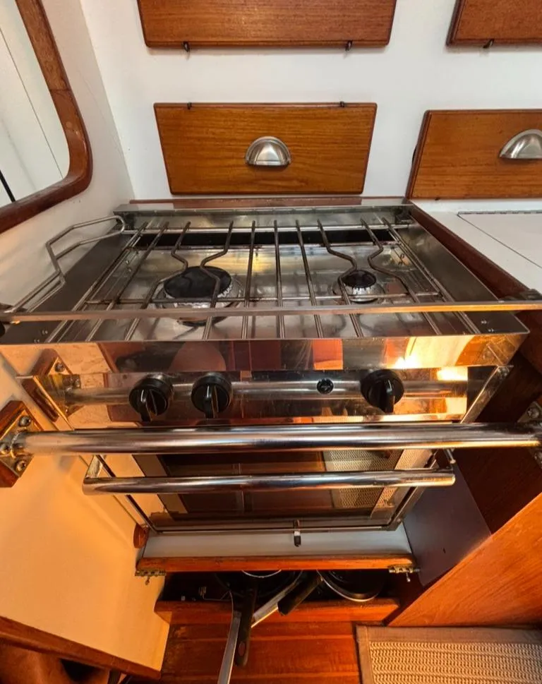 Slide: The Image of Interior of a 1989 Caliber 38 yacht kitchen with sink and stove. - 8