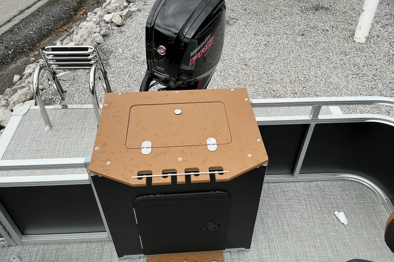 Slide: The Image of 2026 Avalon Venture Rear Fish boat with Mercury outboard motor, featuring a sleek deck design. - 10