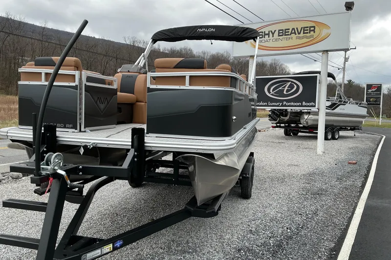Slide: The Image of 2026 Avalon Venture Rear Fish 21' pontoon boat displayed at a dealership. - 3