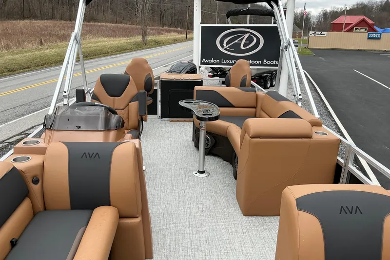 Slide: The Image of 2026 Avalon Venture Rear Fish 21' pontoon boat with luxurious seating and modern design. - 4