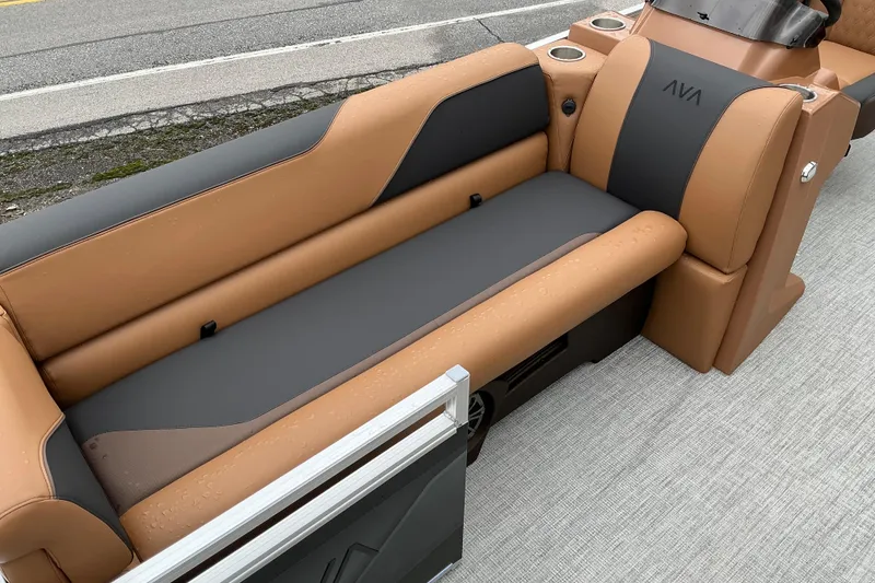 Slide: The Image of Luxurious seating on 2026 Avalon Venture Rear Fish 21' pontoon boat, featuring tan and gray upholstery. - 5