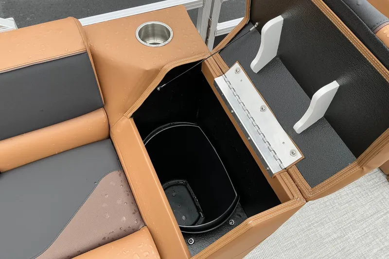 Slide: The Image of Interior of 2026 Avalon Venture Rear Fish boat with storage compartment and cup holder. - 6