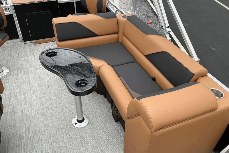 Slide: The Image of Luxurious seating area on 2026 Avalon Venture Rear Fish boat with sleek table design. - 7
