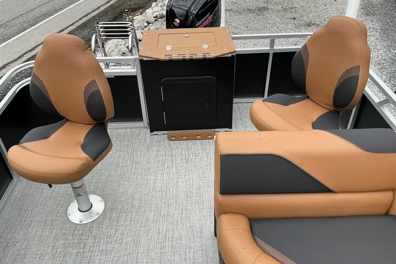 Slide: The Image of 2026 Avalon Venture Rear Fish boat interior with tan and black seating. - 9