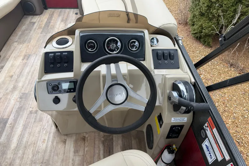 Slide: The Image of Steering console of a 2018 Crest I boat with gauges and controls. - 11
