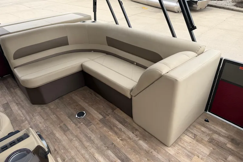 Slide: The Image of Beige seating area on 2018 Crest I pontoon boat with wood-style flooring. - 8