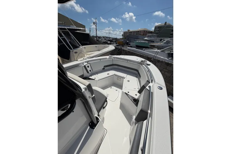 Slide: The Image of 2018 Blackfin 242 CC boat interior with cushioned seating and sleek design. - 11