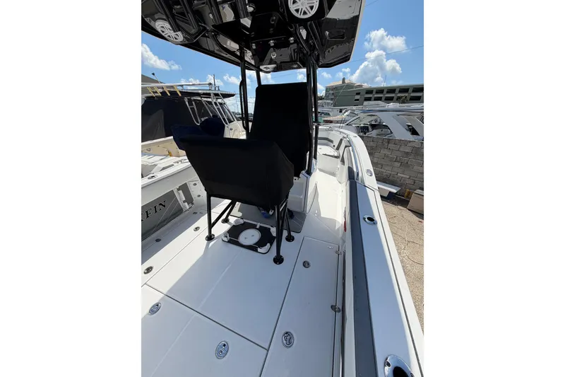 Slide: The Image of 2018 Blackfin 242 CC boat interior with sleek seating and modern design. - 17