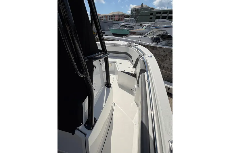 Slide: The Image of Interior of 2018 Blackfin 242 CC boat featuring a compact marine toilet. - 22