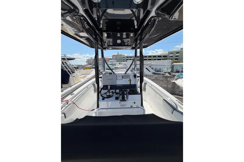 Slide: The Image of 2018 Blackfin 242 CC boat with dual engines and Magma cutting board. - 8