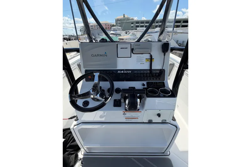 Slide: The Image of 2018 Blackfin 242 CC boat with Mercury outboard engines and foldable seating. - 9