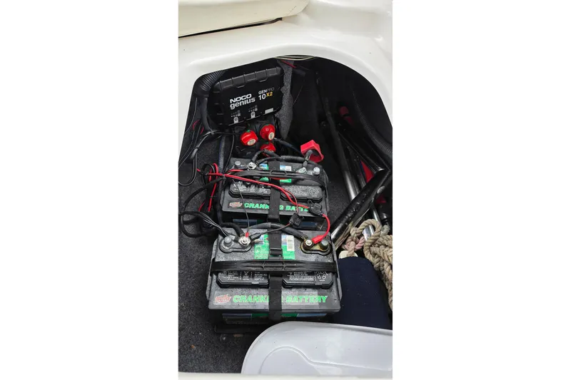 Slide: The Image of Battery compartment of a 2014 Yamaha Boats 242 Limited with NOCO Genius charger. - 4