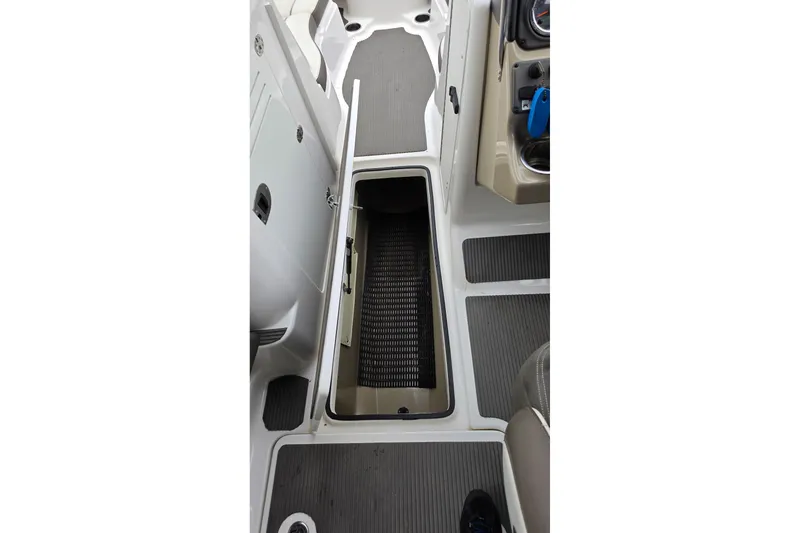 Slide: The Image of 2014 Yamaha Boats 242 Limited interior storage compartment, open view. - 8