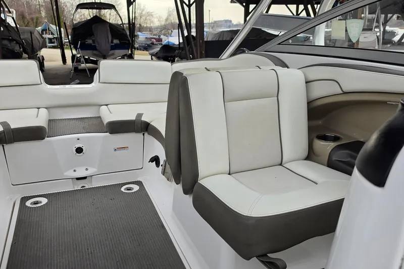 Slide: The Image of Interior of 2014 Yamaha Boats 242 Limited, featuring white and gray seating. - 9