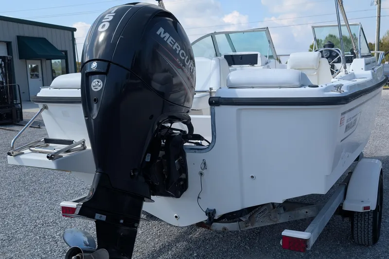 Slide: The Image of 1998 Boston Whaler Ventura 20 boat with Mercury 150 outboard motor on trailer. - 3