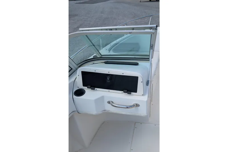 Slide: The Image of 1998 Boston Whaler Ventura 20 boat interior with windshield and storage compartment. - 6
