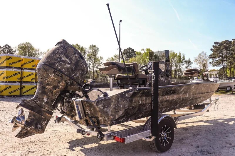 Slide: The Image of 2026 Excel 203 Bay Pro Elite boat with camouflage design on a trailer. - 5