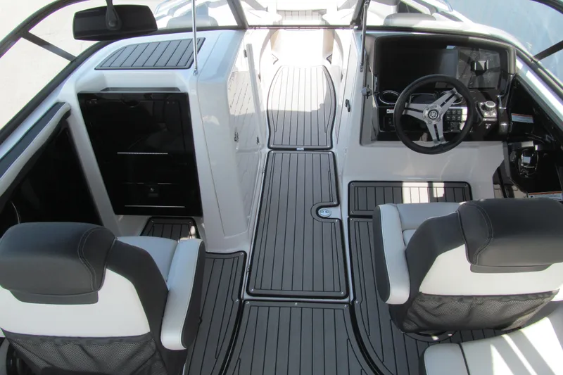 Slide: The Image of 2018 Yamaha Boats 242 Limited S interior with sleek seating and modern dashboard design. - 7