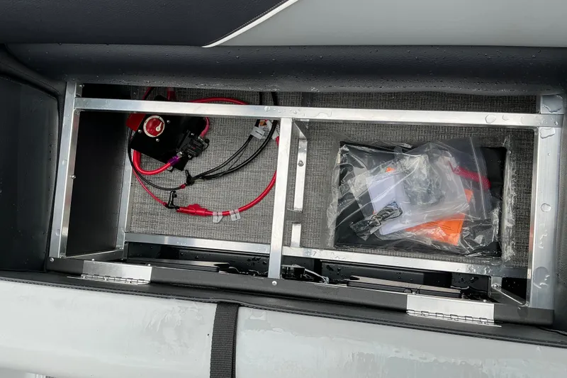 Slide: The Image of Interior view of Avalon Venture 23 Quad Lounge 2026, showcasing storage compartment and wiring. - 12