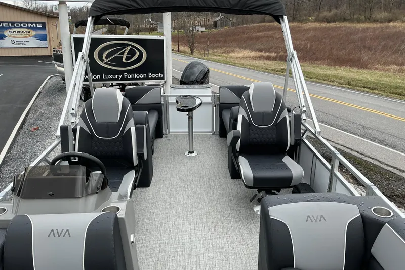 Slide: The Image of 2026 Avalon Venture 23 Quad Lounge pontoon boat with luxurious seating and sleek design. - 5