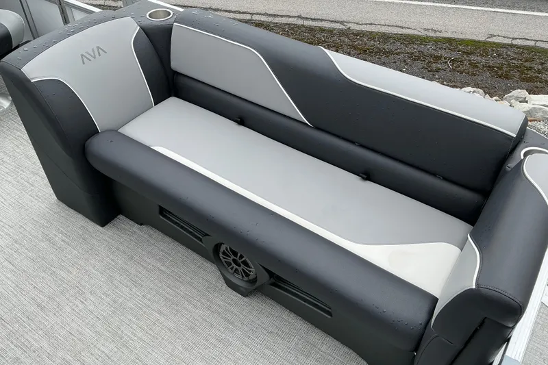 Slide: The Image of 2026 Avalon Venture 23 Quad Lounge boat seat, gray and black upholstery, outdoor setting. - 6