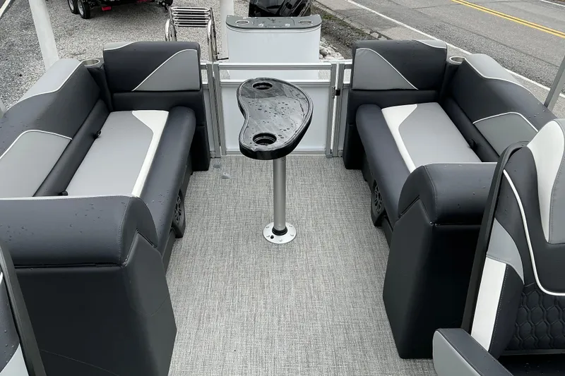 Slide: The Image of Interior of 2026 Avalon Venture 23 Quad Lounge with sleek seating and central table. - 7