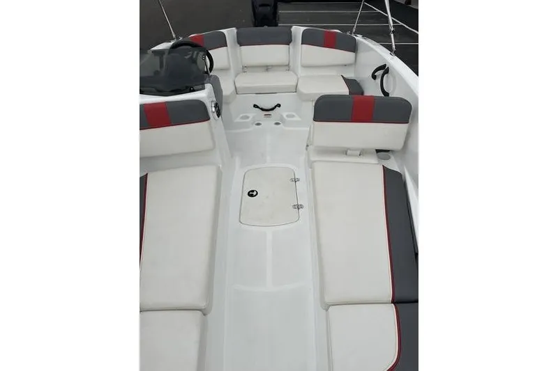 Slide: The Image of 2021 Tahoe T16 boat interior with white and gray seating, red accents. - 10